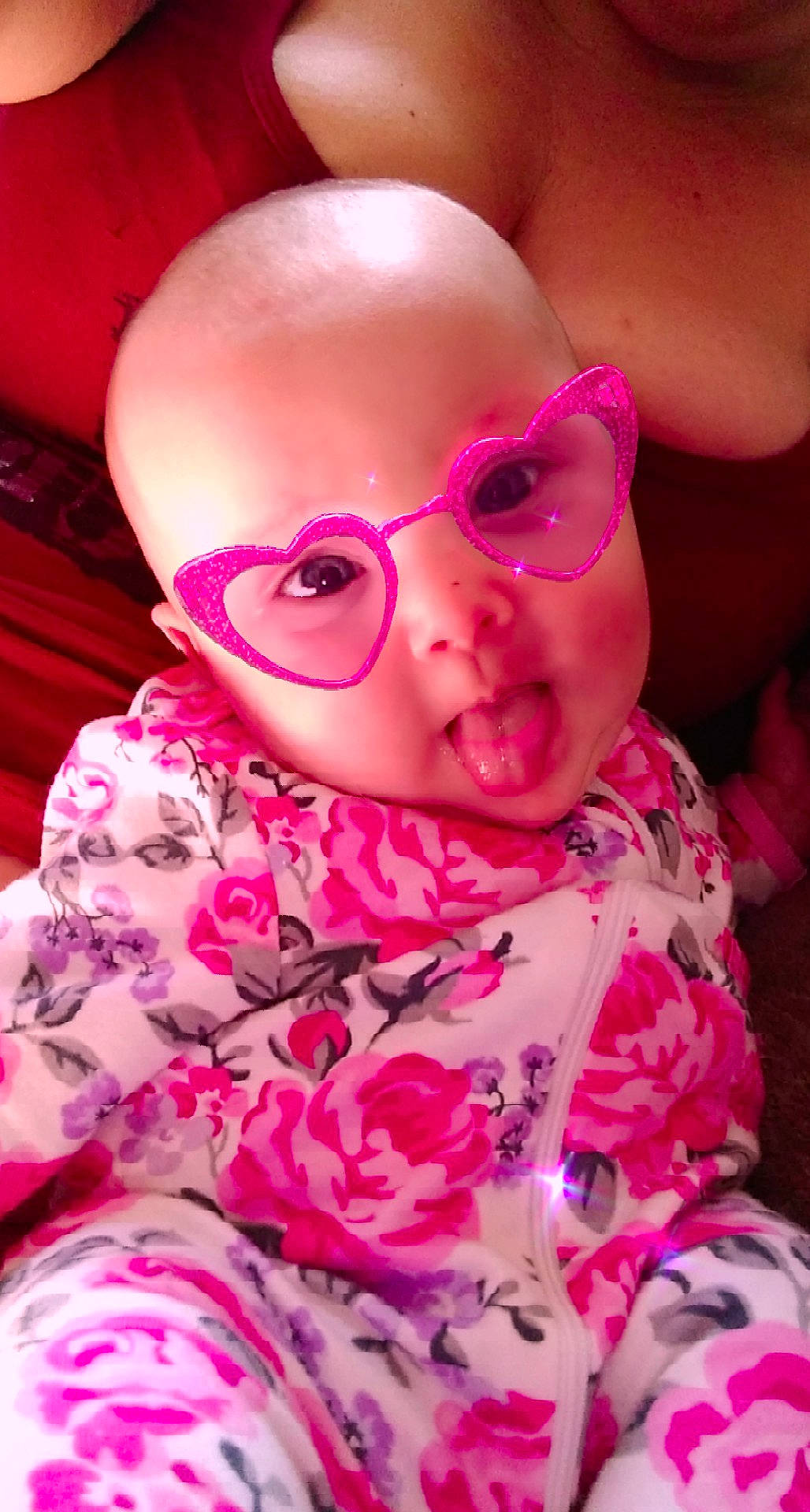 Kelsea joined the competition — help win amazing prizes! baby, baby_toddler_clothing, cheek, eyewear, glasses, goggles, happy, head, headgear, lip, magenta, nose, person, personal_protective_equipment, petal, pink, sleeve, sunglasses, toddler, toy