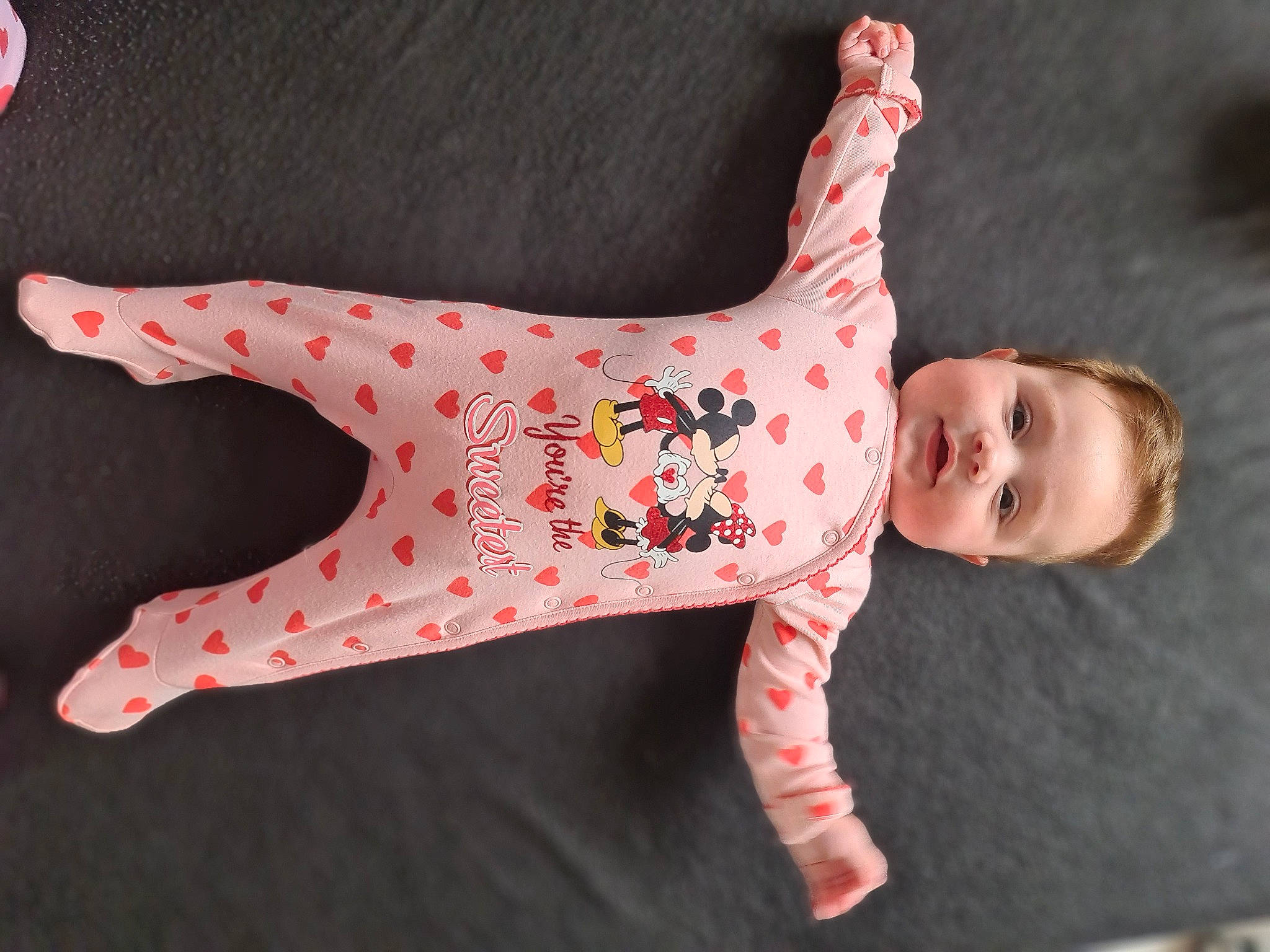 Evelina is registered to the contest to win money with this photo: baby, baby_toddler_clothing, carmine, fawn, foot, happy, human_body, human_leg, linens, magenta, pattern, peach, person, polka_dot, sleeve, smile, tail, toddler, toy