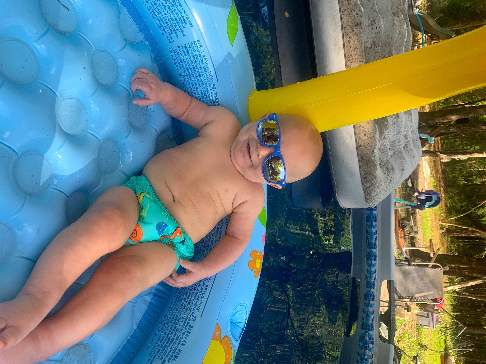 Jason is registered to the contest to win money with this photo: azure, blue, child, electric_blue, finger, fun, grass, happy, human_leg, leisure, nail, people_in_nature, person, recreation, summer, textile, thigh, thumb, toddler, water