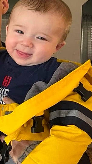 Princeton joined the competition — help win amazing prizes! baby, baby_products, baby_toddler_clothing, cheek, child, eye, facial_expression, finger, happy, joy, nose, orange, outerwear, person, personal_protective_equipment, sitting, skin, sleeve, smile, t_shirt