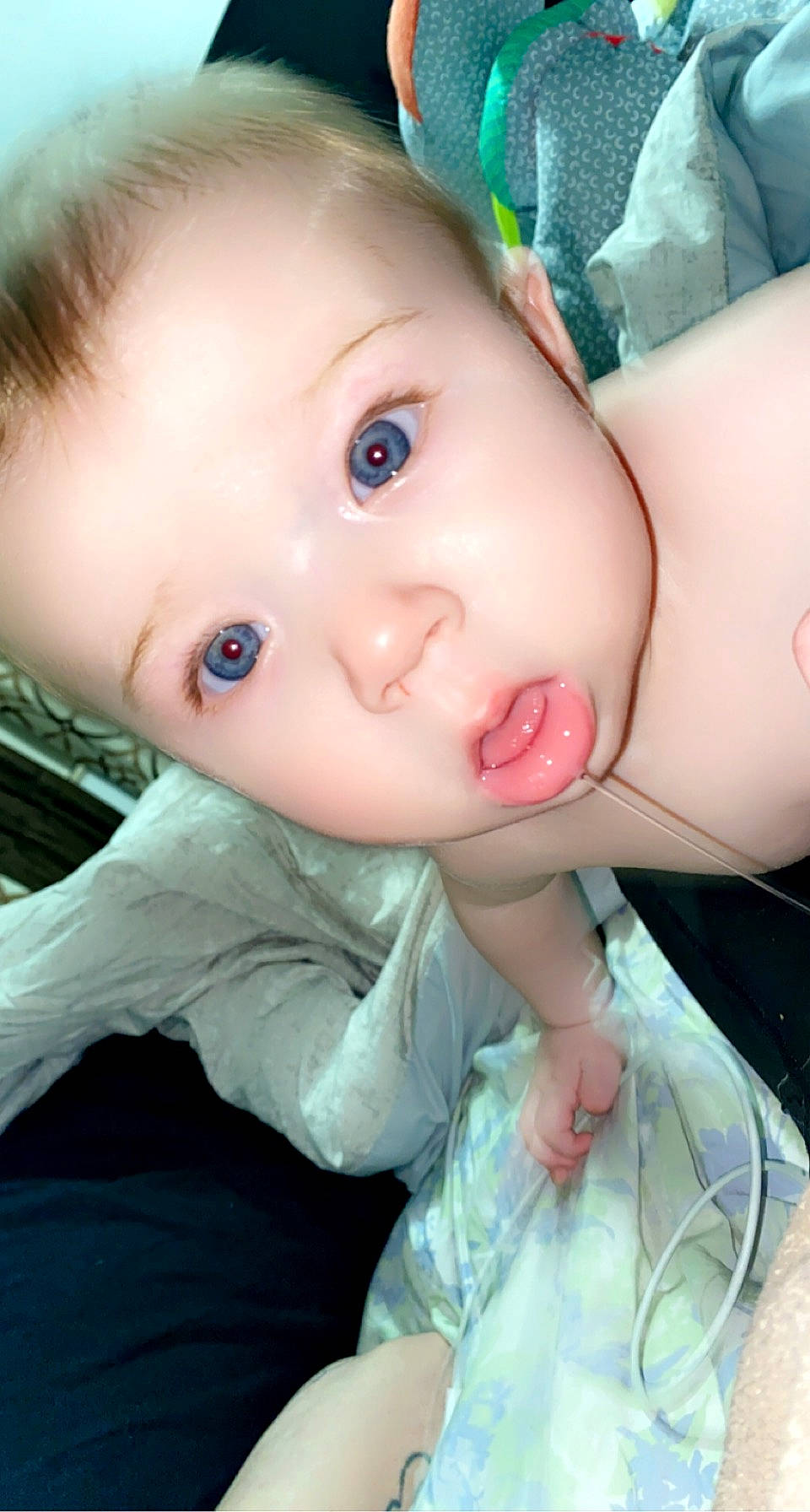 Princeton is registered to the contest to win money with this photo: baby_toddler_clothing, blue, cheek, chin, dress, eye, eyebrow, eyelash, finger, forehead, gesture, happy, head, iris, lip, mouth, nose, organ, person, pink
