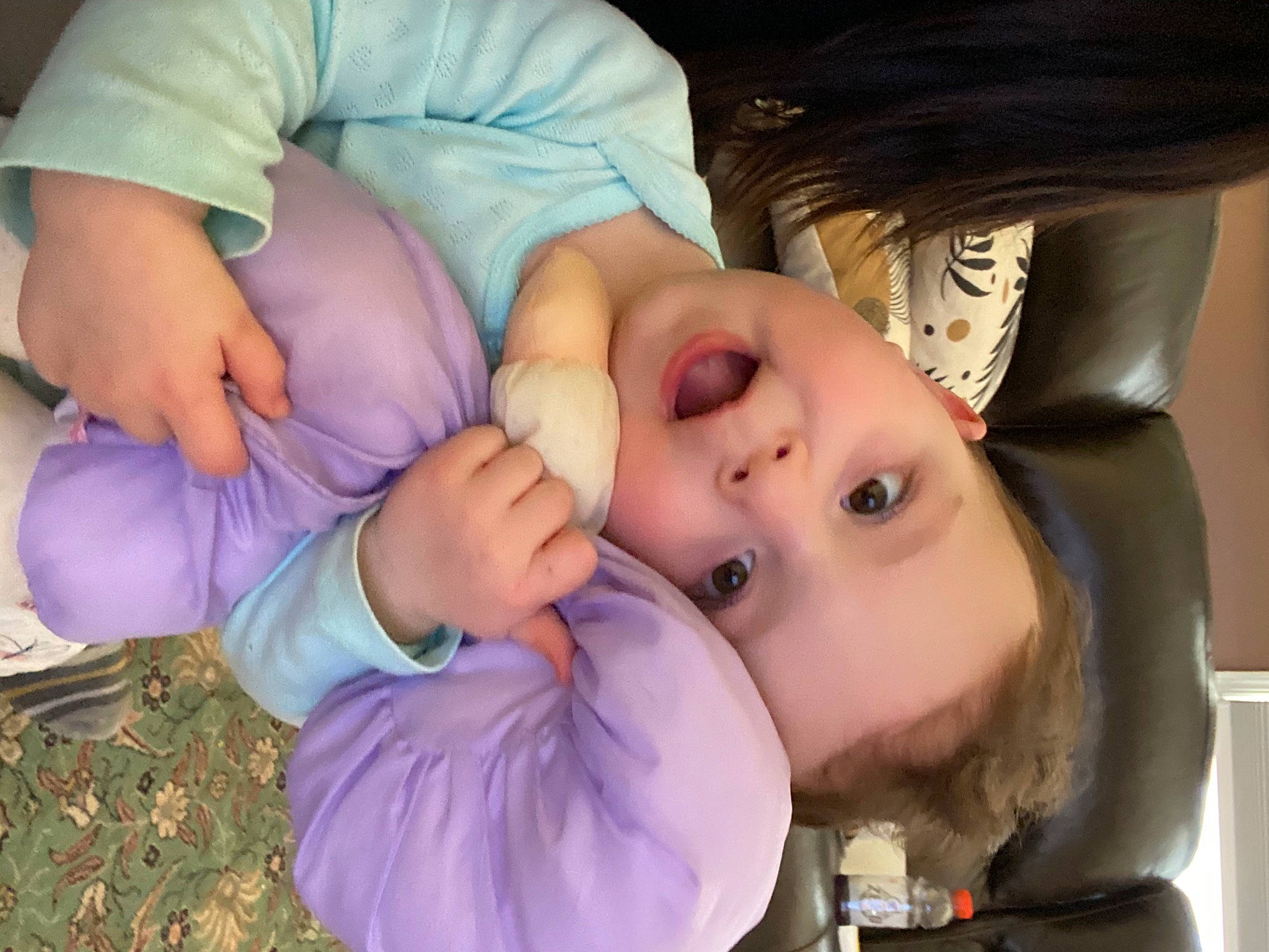 Cecelia is registered to the contest to win money with this photo: baby, baby_toddler_clothing, cheek, child, comfort, eyelash, finger, fun, gesture, grass, hand, happy, lip, mouth, nail, nose, person, purple, skin, thumb