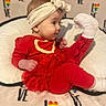 baby, blanket, child, clothing, cute, face, fun, happy, headband, indoors, infant, love, playful, rainbow, red_clothing, sitting, smile, sock, soft_texture, toddler