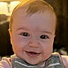 Caroline is registered to the contest to win money with this photo: baby, face, smile, child, portrait, closeup, happy, infant, person, indoors, clothing, young, cute, cute_baby, head, eyes, skin, expression, warm_lighting, background_blur