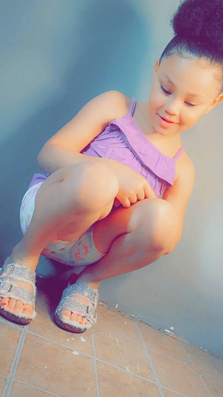 Kaleigha is registered to the contest to win money with this photo: baby_toddler_clothing, barefoot, calf, dress, electric_blue, finger, flash_photography, foot, fun, happy, human_leg, knee, leg, leisure, people_in_nature, person, pink, shoe, thigh, toddler