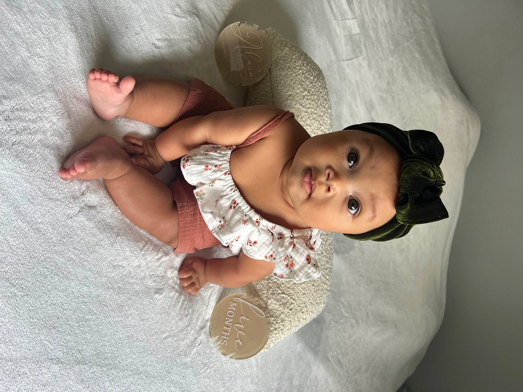 Alaia is registered to the contest to win money with this photo: abdomen, baby, baby_toddler_clothing, chest, child, comfort, elbow, eye, finger, flash_photography, flooring, headwear, human, joint, leg, linens, mammal, mouth, person, skin
