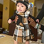 Arriya is registered to the contest to win money with this photo: accessories, adult, baby, bodypart, bonnet, cap, clothing, coat, dress, face, female, finger, hand, hat, head, pants, person, photography, portrait, woman