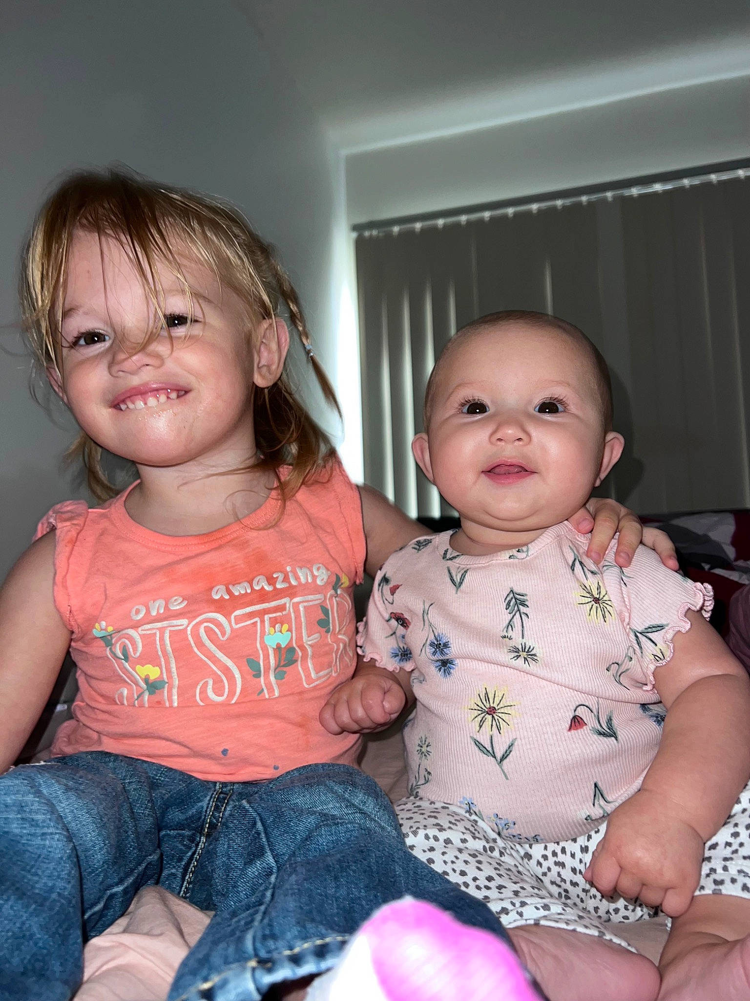 Lana is registered to the contest to win money with this photo: baby, baby_toddler_clothing, cheek, child, chin, eye, finger, fun, hairstyle, happy, iris, joy, mammal, nose, person, pink, product, skin, smile, standing