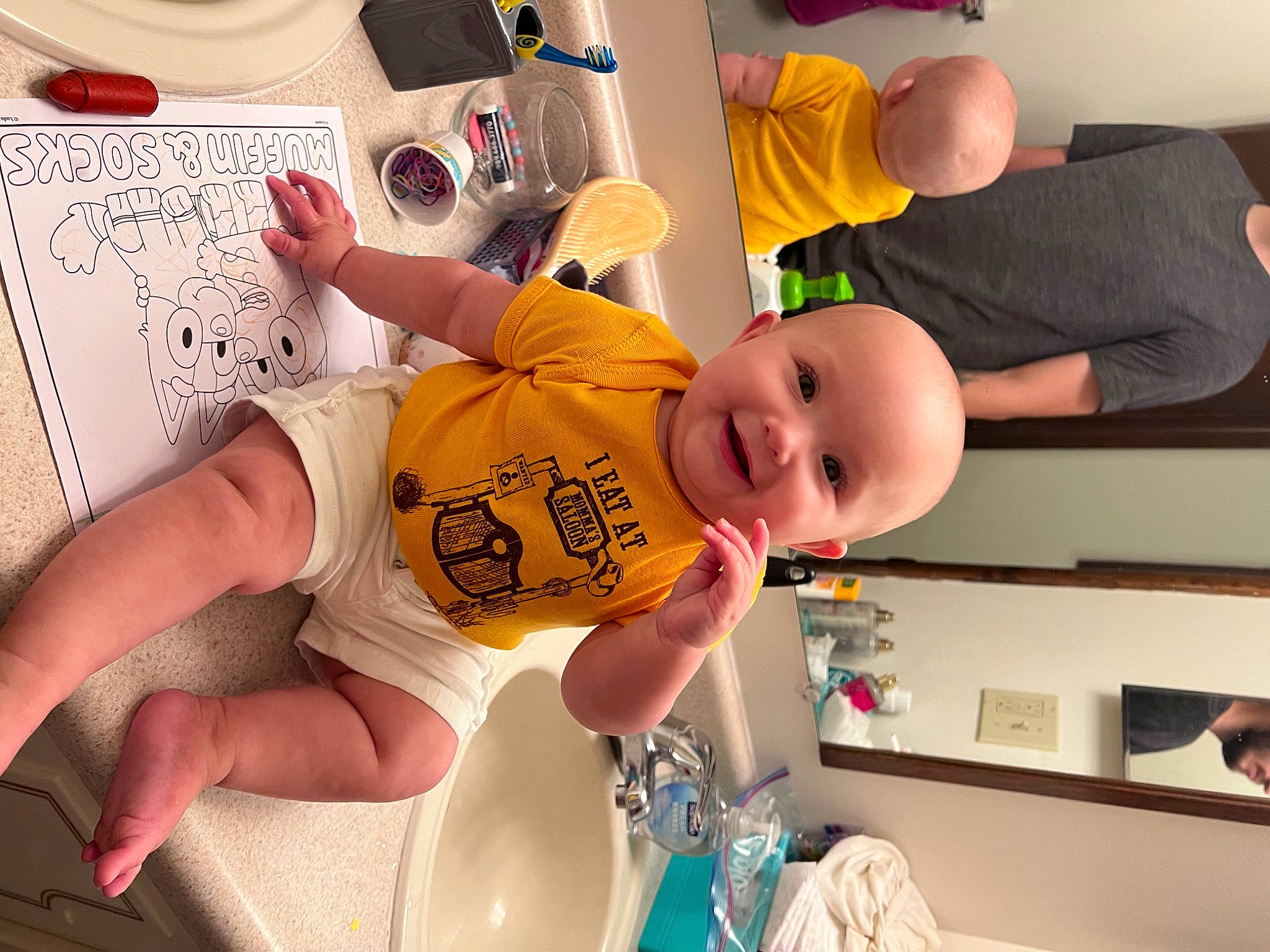 Lana is registered to the contest to win money with this photo: arm, baby, baby_products, baby_toddler_clothing, chair, child, comfort, finger, fun, handwriting, happy, joy, person, room, smile, t_shirt, thigh, thumb, toddler, writing