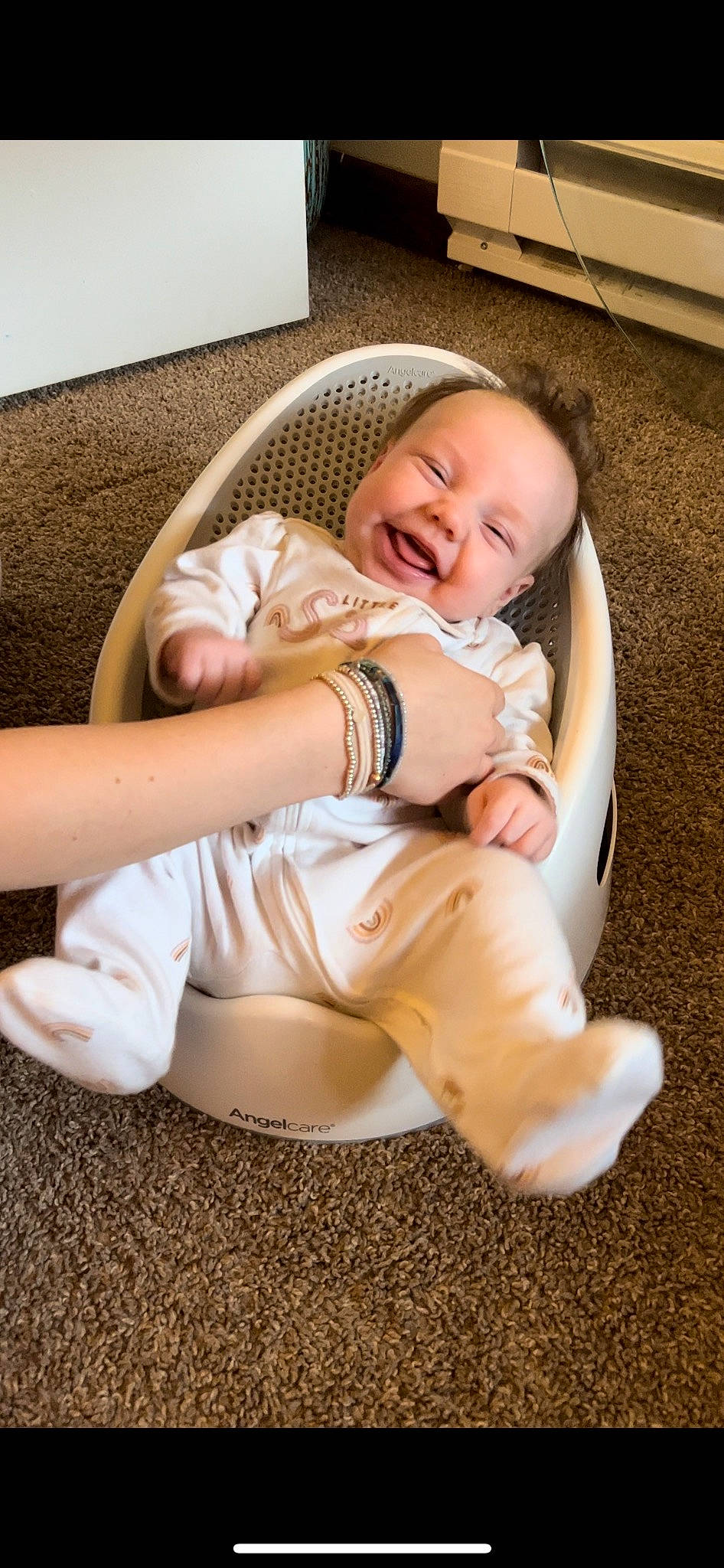 June Lee joined the competition — help win amazing prizes! baby, baby_products, baby_toddler_clothing, cheek, child, comfort, face, flooring, fun, happy, human_leg, joy, knee, linens, person, sitting, skin, sleeve, smile, sock