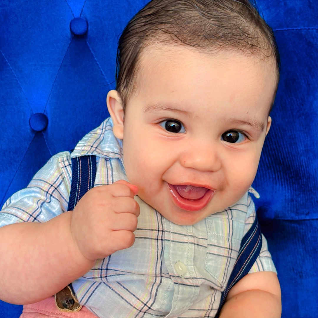 Victor joined the competition — help win amazing prizes! baby, blue_chair, child, clothing, cushioned_chair, cute, eyes, face, hand_holding, happy, indoor, infant, mouth, person, pink_pants, plaid_shirt, portrait, skin, smiling, suspenders