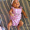 Mylah joined the competition — help win amazing prizes! baby, casual, child, cute, headband, human, indoors, infant, lying_down, one_person, person, plaid_pattern, portrait, purple_clothing, relaxing, small_child, smiling, soft_lighting, striped_bedspread, young_child