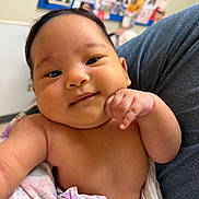 Mylah joined the competition — help win amazing prizes! baby, background, blanket, child, chubby, closeup, clothing, cute, expression, face, hand, holding, indoor, infant, person, portrait, skin, smile, soft, young
