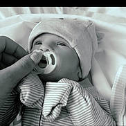 Stetson joined the competition — help win amazing prizes! baby, infant, pacifier, hat, striped_clothing, hand, nail_art, blanket, bed, soft_lighting, black_and_white, cute, portrait, newborn, sleepwear, closeup, cozy, toddler, resting, comfort