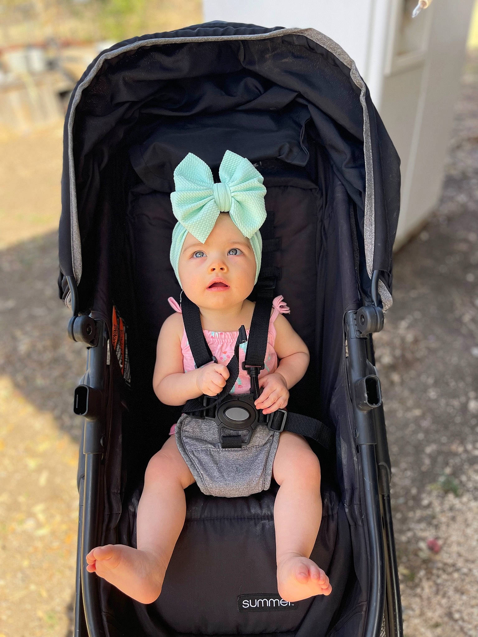 Jodie is registered to the contest to win money with this photo: baby, baby_carriage, baby_products, baby_safety, baby_toddler_clothing, bag, baggage, black, chair, child, comfort, eye, fashion_accessory, folding_chair, headwear, luggage_and_bags, person, personal_protective_equipment, product, sitting