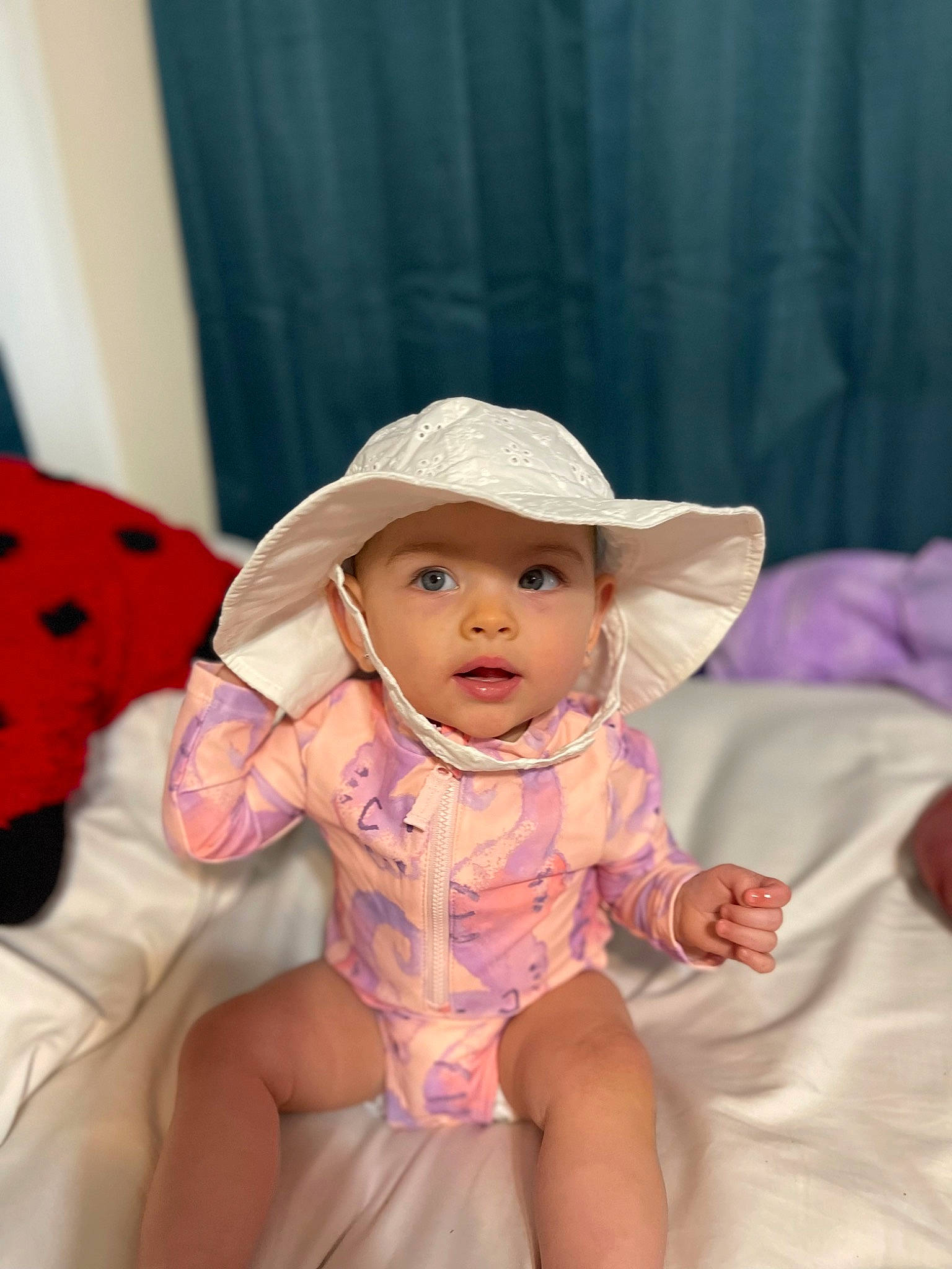 Jodie joined the competition — help win amazing prizes! baby, baby_toddler_clothing, cheek, child, comfort, curtain, dress, fun, happy, hat, headgear, headwear, lip, person, pink, purple, sitting, skin, sleeve, smile