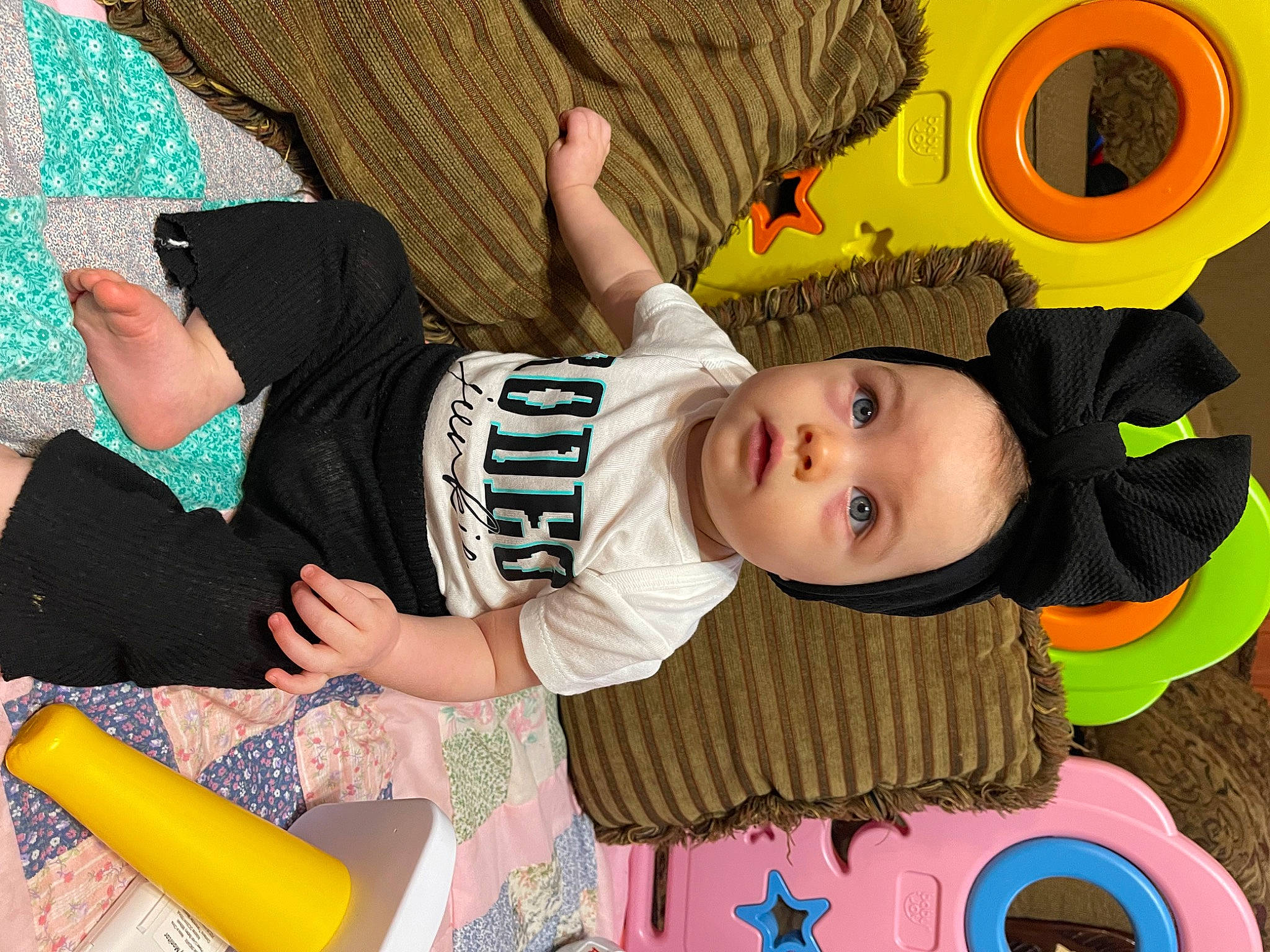 Jodie is registered to the contest to win money with this photo: baby, baby_playing_with_toys, baby_products, baby_toddler_clothing, baby_toys, cheek, child, comfort, fun, happy, pattern, person, play, product, room, sitting, sleeve, t_shirt, toddler, writing_implement