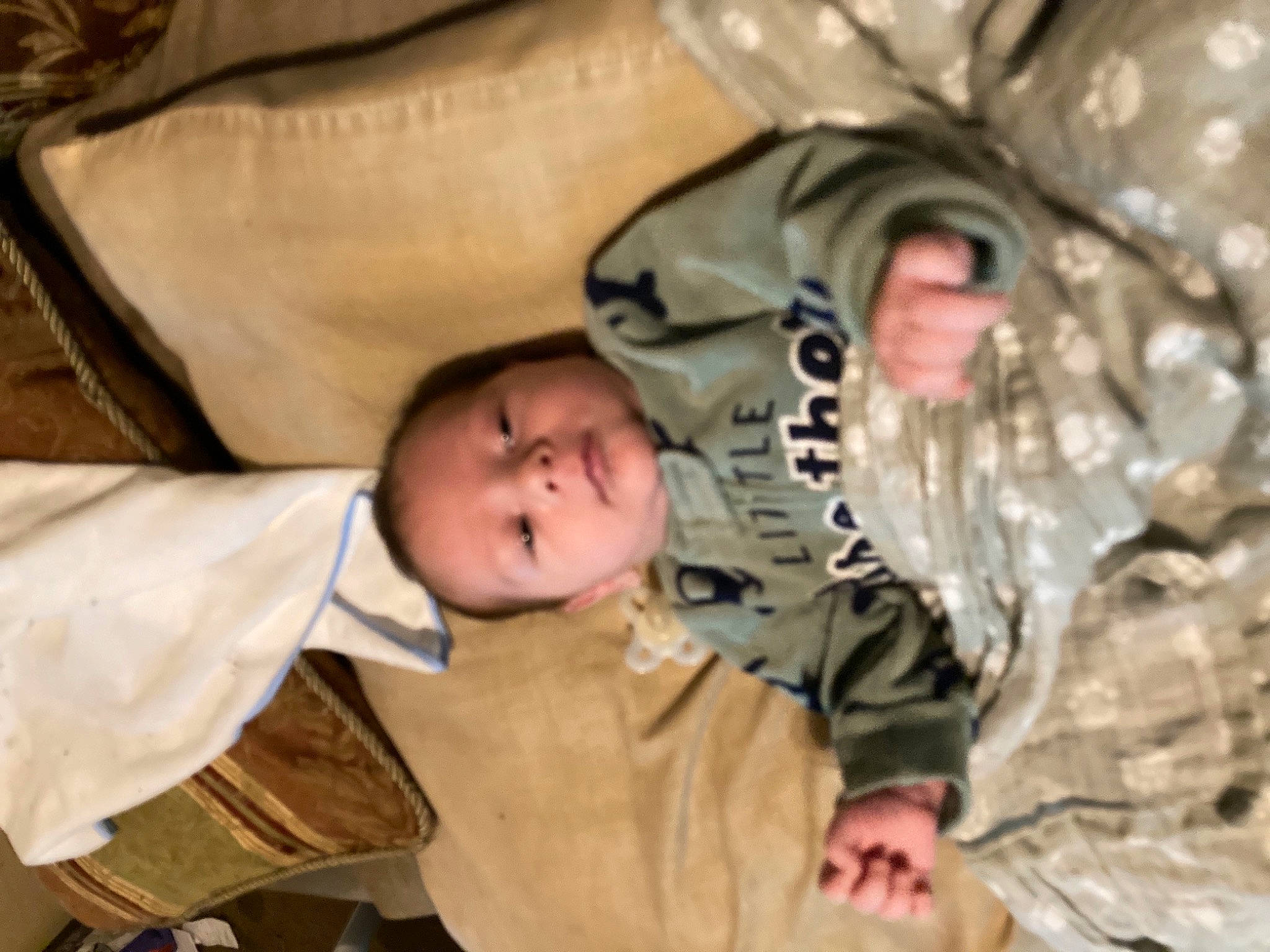 Liam is registered to the contest to win money with this photo: army, baby, baby_toddler_clothing, camouflage, child, comfort, eye, gesture, infantry, marines, military, military_camouflage, military_organization, military_person, military_uniform, non_commissioned_officer, pattern, person, sleeve, soldier