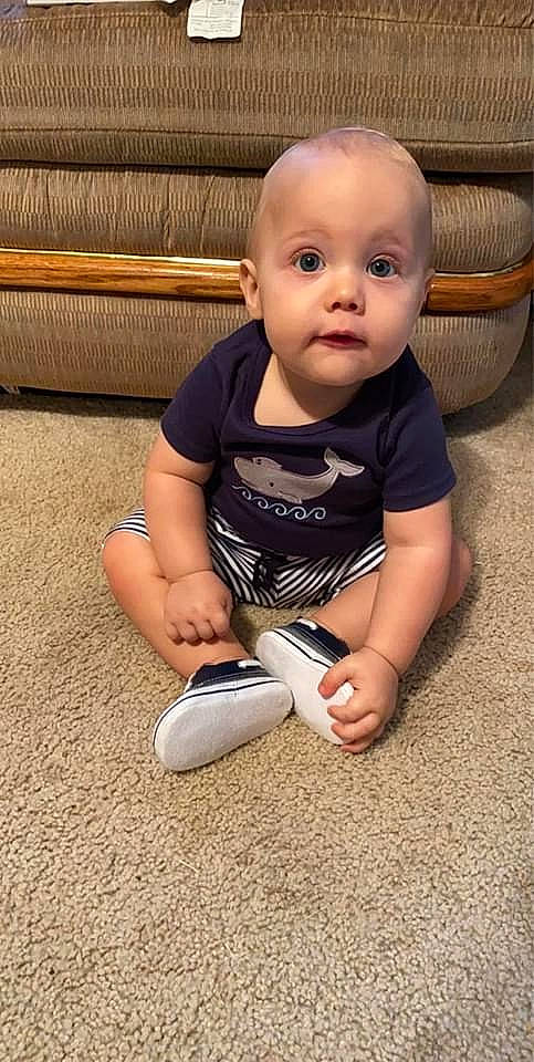 Karsen is registered to the contest to win money with this photo: ankle, baby, baby_products, baby_toddler_clothing, cheek, child, comfort, flooring, foot, knee, nail, person, shoe, sitting, skin, sock, surprise, toddler, toe, walking_shoe
