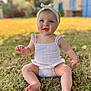 baby, child, grass, outdoor, smiling, headband, blue_eyes, summer_clothing, barefoot, nature, sunlight, cute, portrait, sitting, infant, happy, skin, person, daylight, background_blur