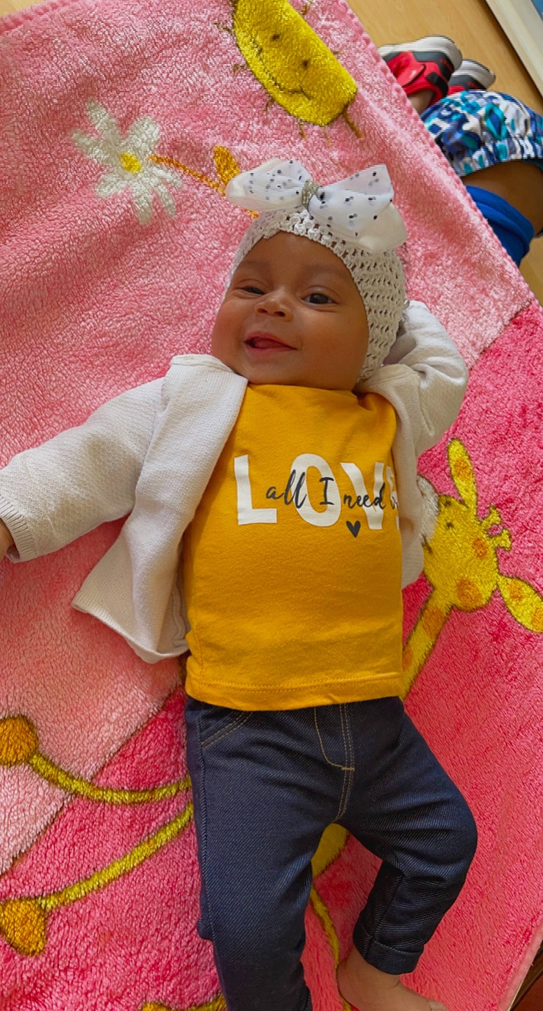 Fatima participe au concours pour gagner de l'argent avec cette photo : baby, baby_products, baby_sleeping, baby_toddler_clothing, cheek, child, eye, face, fun, happy, headgear, headwear, jacket, linens, magenta, person, pink, red, skin, sleeve