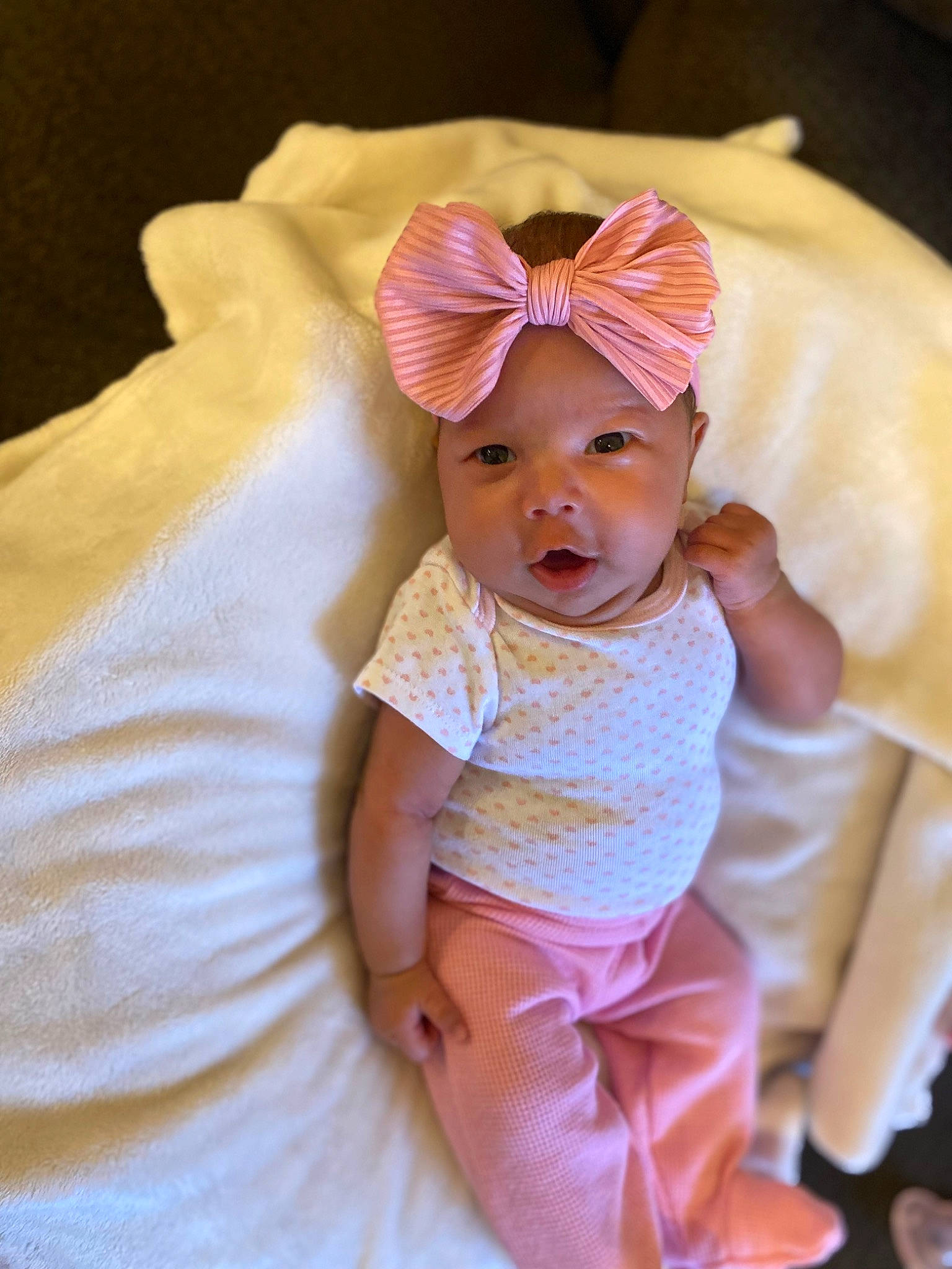 Sophia Grace is registered to the contest to win money with this photo: baby, baby_toddler_clothing, cap, cheek, child, comfort, face, fashion_accessory, hair_accessory, happy, headband, headgear, headpiece, headwear, linens, magenta, peach, person, pink, skin