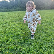 Hunter-lee is registered to the contest to win money with this photo: bushes, casual, child, cute, daylight, field, footwear, grass, greenery, happy, nature, onesie, outdoor, playful, portrait, running, smiling, toddler, trees, young_child