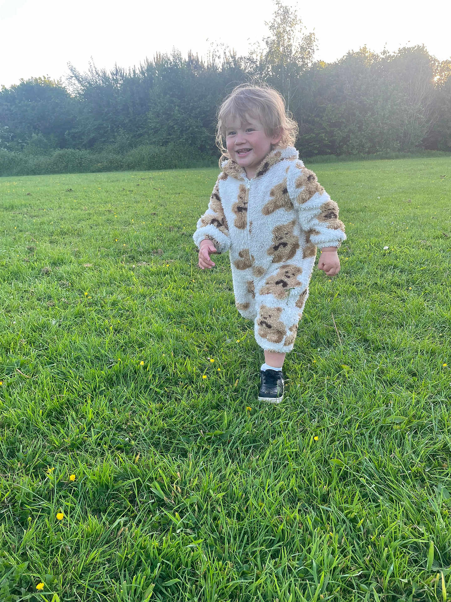 Hunter-lee is registered to the contest to win money with this photo: bushes, casual, child, cute, daylight, field, footwear, grass, greenery, happy, nature, onesie, outdoor, playful, portrait, running, smiling, toddler, trees, young_child