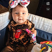 Saige is registered to the contest to win money with this photo: baby, birthdaycake, boy, cake, child, clothing, couch, cream, dessert, face, food, furniture, hat, head, icing, male, people, person, photography, portrait