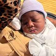 Daniel joined the competition — help win amazing prizes! newborn, baby, sleeping, beanie, mittens, blanket, leopard_print, fabric, cozy, indoor, soft_light, closeup, infant, resting, cute, portrait, child, warm, peaceful, comfort