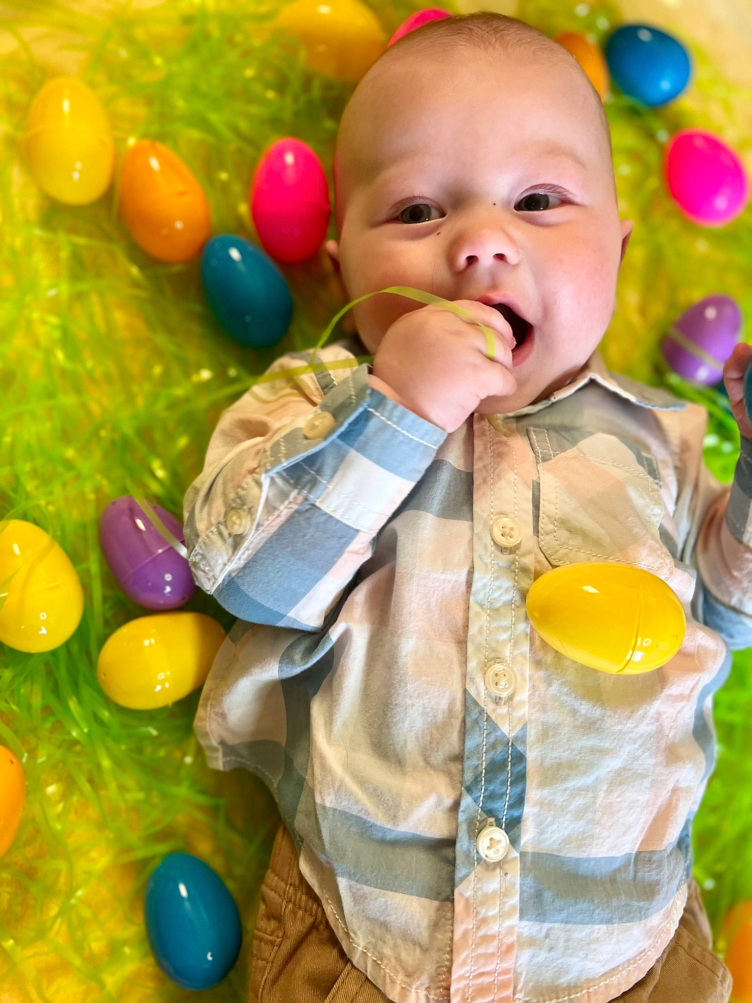 Malcolm is registered to the contest to win money with this photo: baby, ball_pit, balloon, child, event, facial_expression, fun, green, happy, human, orange, party_supply, people, person, photograph, play, smile, snapshot, tie, toddler