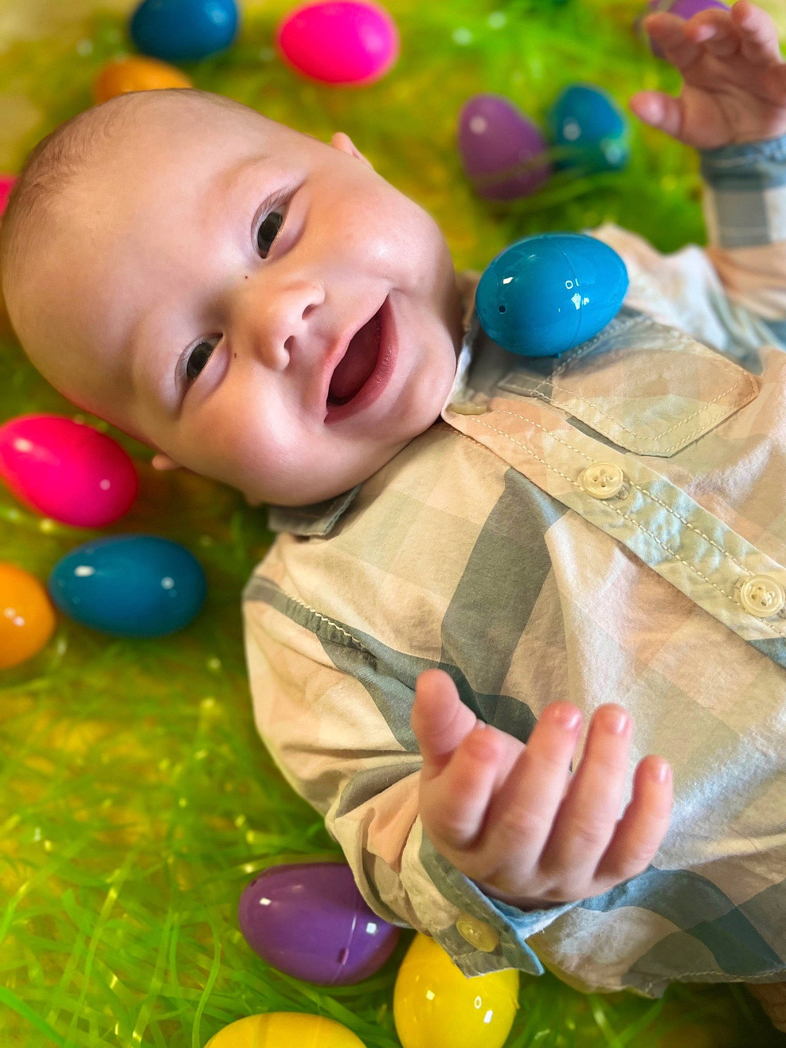 Malcolm is registered to the contest to win money with this photo: baby, baby_laughing, baby_toddler_clothing, cheek, child, event, facial_expression, fun, gesture, grass, green, happy, party_supply, people, person, photograph, play, smile, snapshot, toddler
