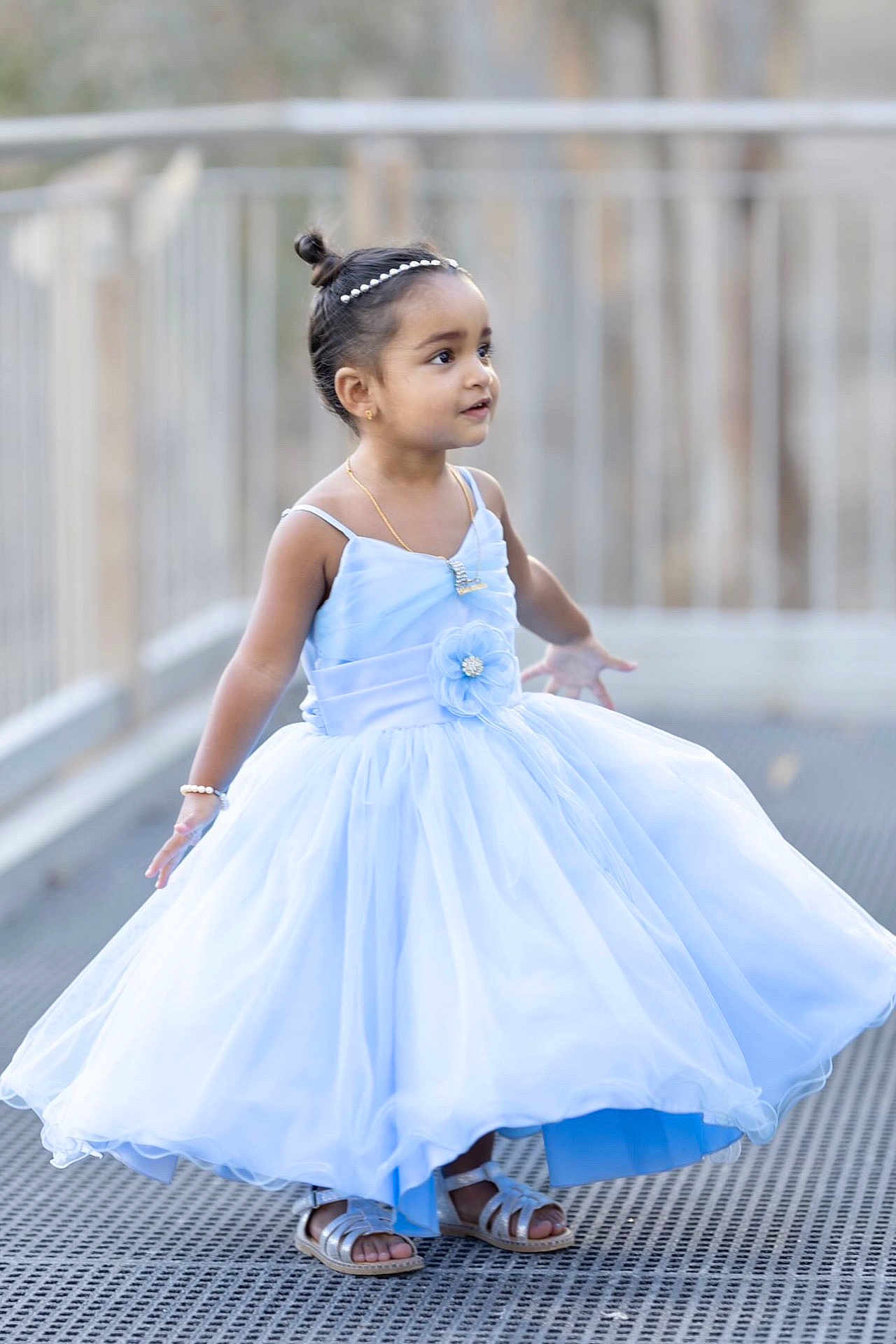 Teana participe au concours pour gagner de l'argent avec cette photo : child, girl, blue_dress, twirling, happy, outdoor, sandals, headband, jewelry, portrait, smiling, young_child, fashion, cute, full_length, playful, daylight, accessories, expression, standing