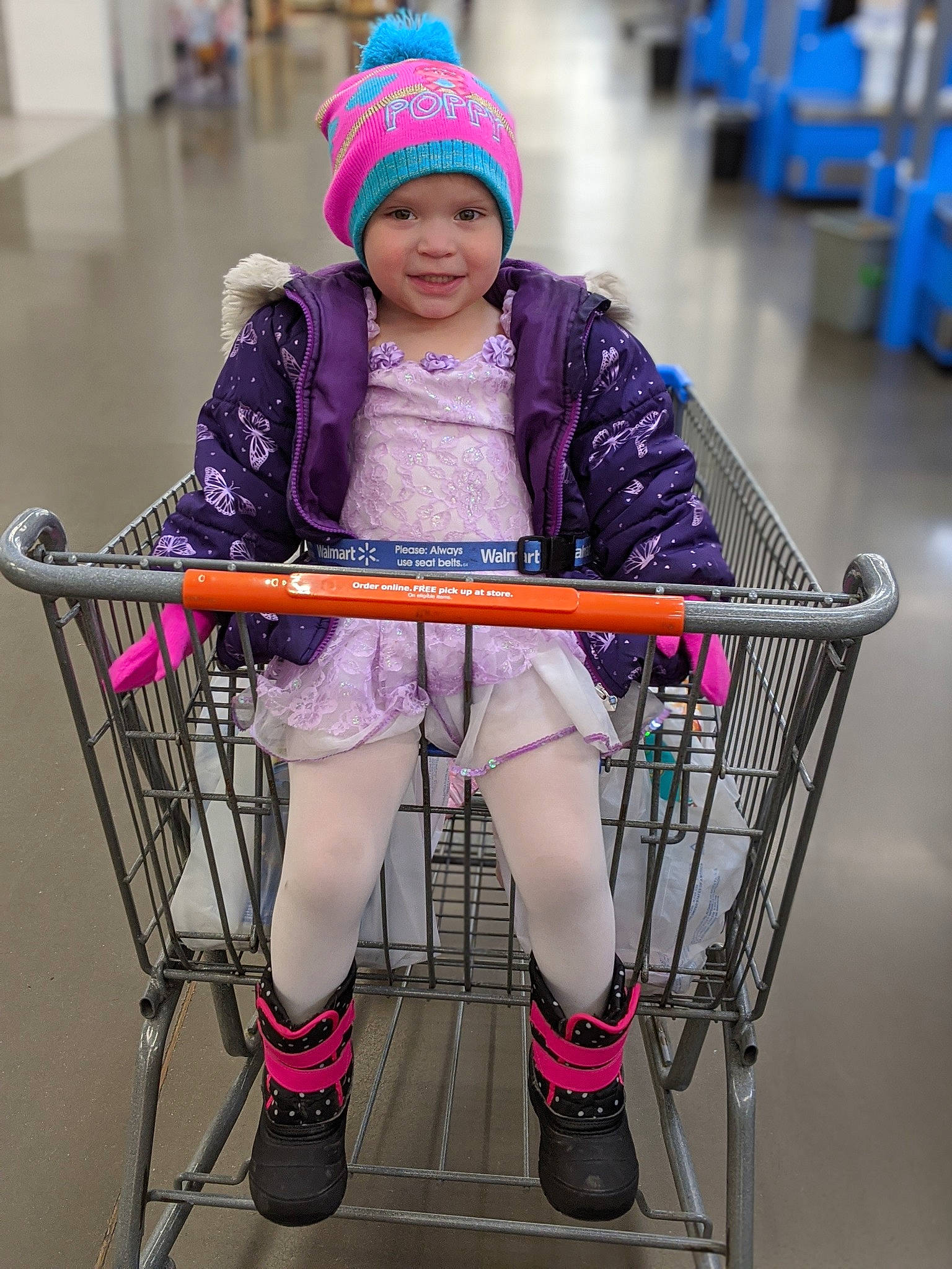 Jazmine is registered to the contest to win money with this photo: cart, child, headwear, joy, leg, person, smile, vehicle