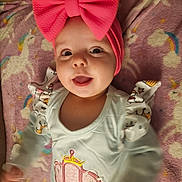 Aurora joined the competition — help win amazing prizes! baby, child, pink_bow, headband, smiling, happy, unicorn_blanket, carriage_design, pastel_clothing, infant, cute, portrait, lying_down, playful, indoors, soft_texture, colorful, apparel, human, closeup