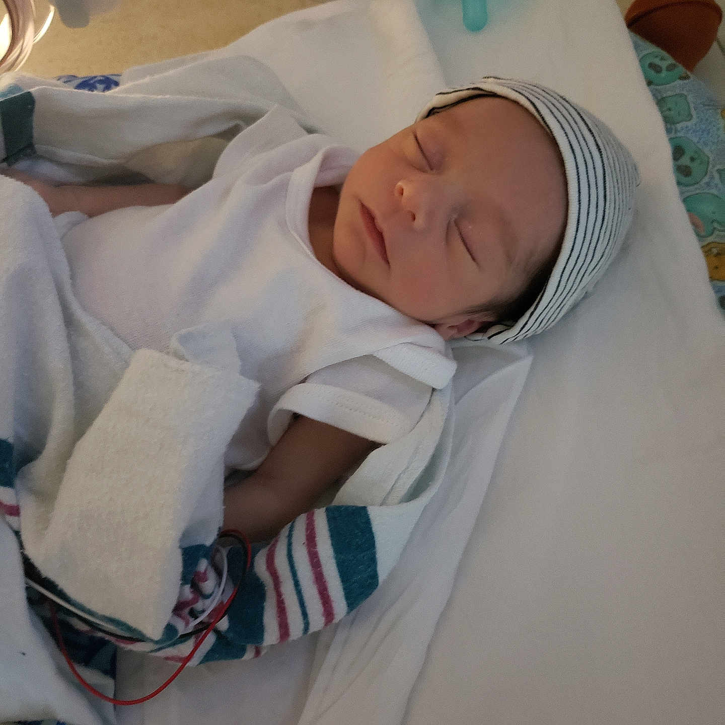 Jayden Malachi joined the competition — help win amazing prizes! architecture, baby, ball, basketball, basketballball, bed, blanket, bonnet, building, clinic, clothing, crib, face, furniture, hat, head, hospital, newborn, person, sport