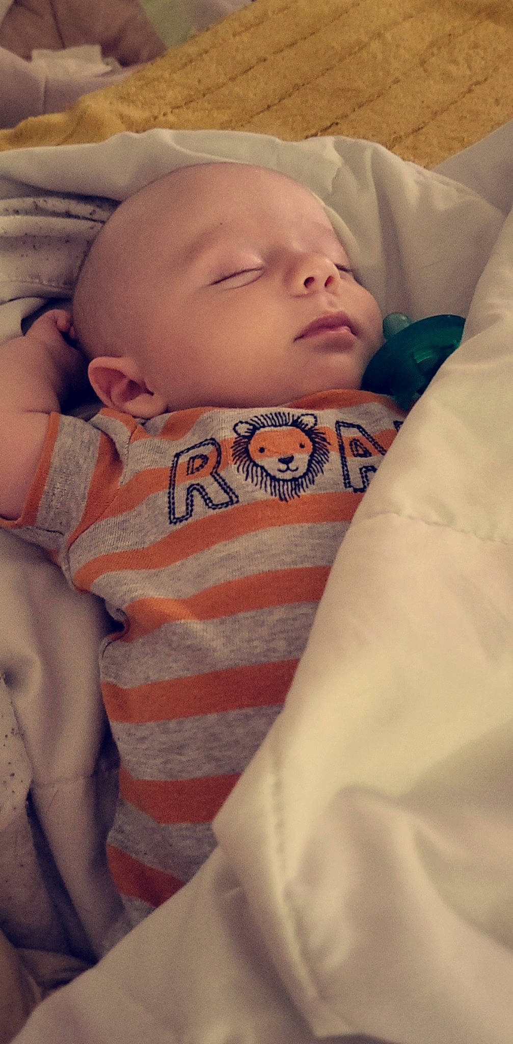 Brodie is registered to the contest to win money with this photo: baby, baby_sleeping, baby_toddler_clothing, cheek, child, comfort, eye, eyebrow, face, head, human_body, linens, lip, mouth, nose, person, skin, sleeve, stomach, textile