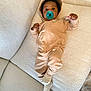 Kaden is registered to the contest to win money with this photo: baby, pacifier, couch, tan_clothing, hoodie, socks, infant, child, relaxed, indoors, nike_logo, soft_fabric, seated, comfortable, cute, small_hands, wide_eyes, casual, baby_clothes, cozy