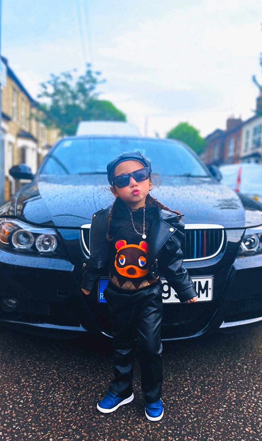 Jacqueline is registered to the contest to win money with this photo: automotive_design, automotive_exterior, automotive_lighting, automotive_tire, bumper, car, eyewear, glasses, goggles, grille, headwear, hood, land_vehicle, motor_vehicle, person, sky, street_fashion, sunglasses, tire, vehicle