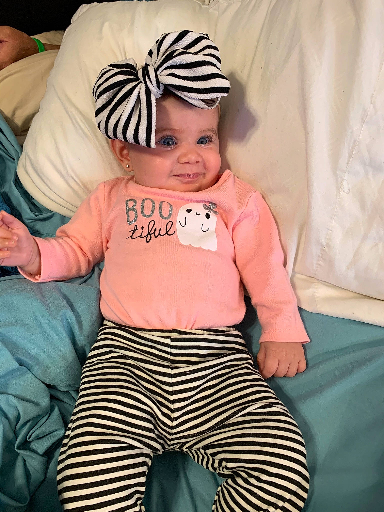 Aryn is registered to the contest to win money with this photo: baby, baby_products, baby_toddler_clothing, child, costume, head, headgear, joy, person, pink, product, sleeve, t_shirt, toddler