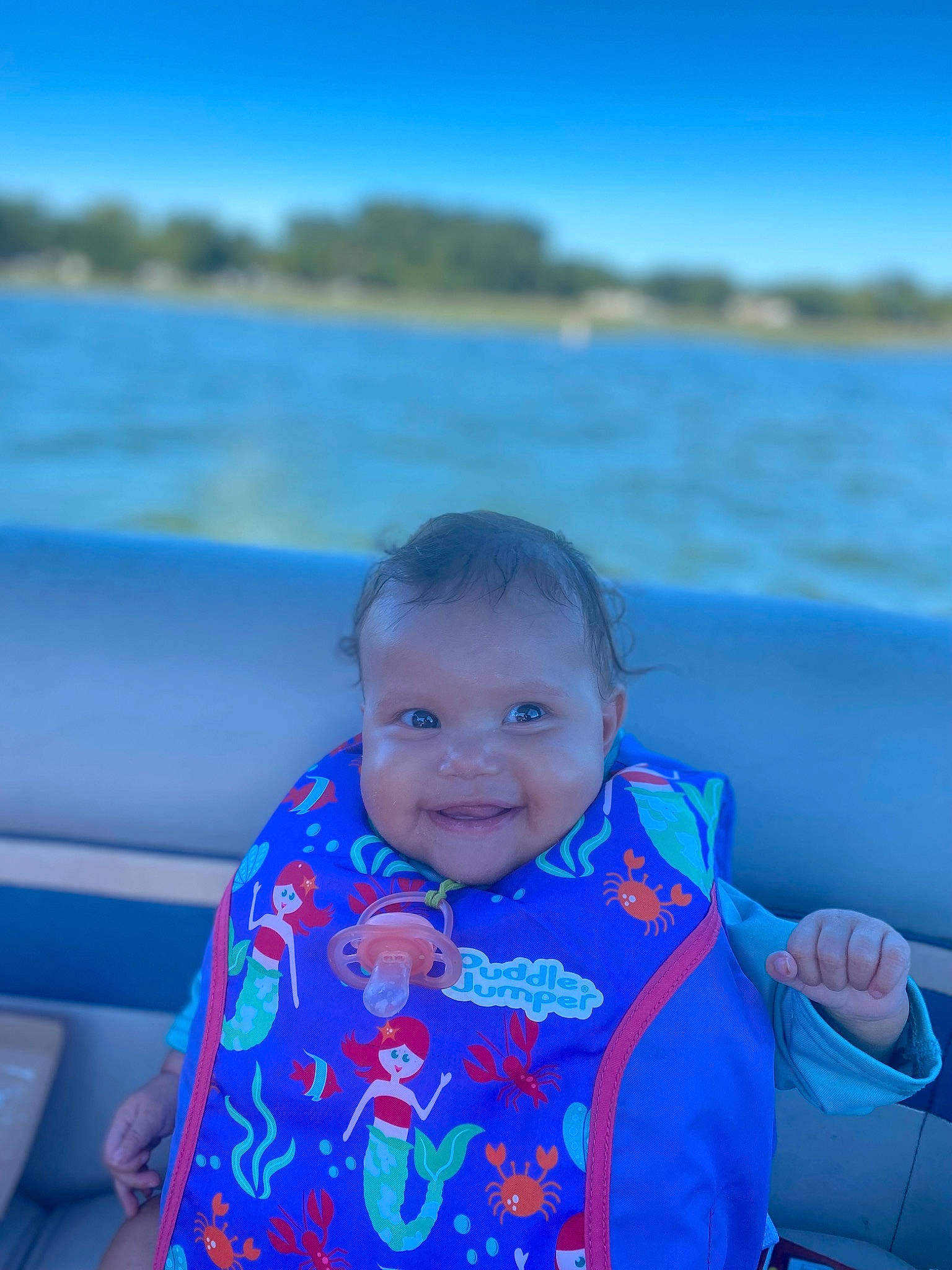 Loveah is registered to the contest to win money with this photo: aqua, azure, baby_toddler_clothing, blue, body_of_water, child, electric_blue, flash_photography, fun, happy, joy, lake, leisure, ocean, person, recreation, sky, smile, summer, toddler