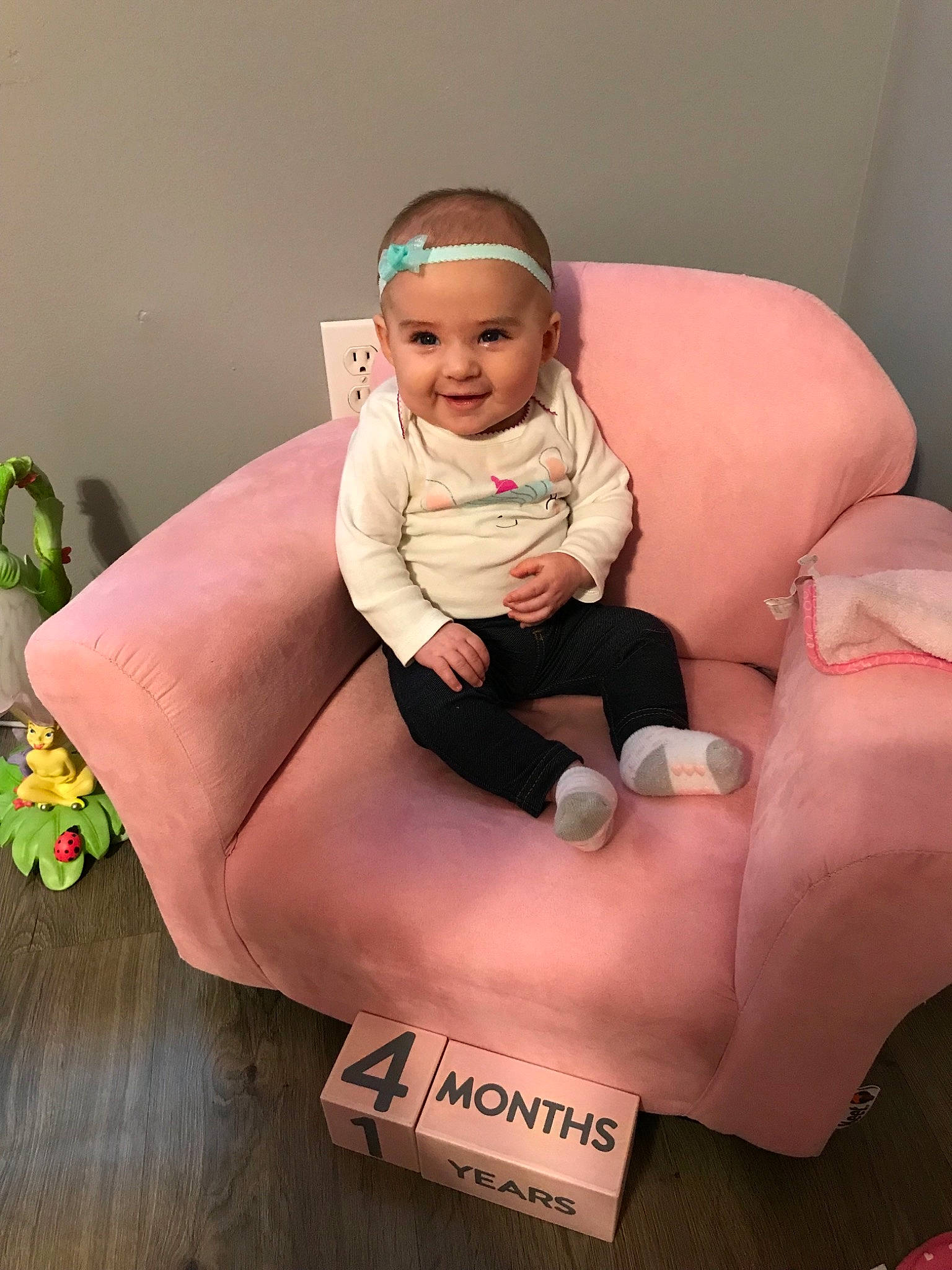 Austyn is registered to the contest to win money with this photo: baby, child, comfort, joy, person, pink, sitting, toddler