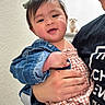 baby, child, adult, denim_jacket, gingham_outfit, stairs, dog, pet, indoor, person, smile, holding, face, hand, hair_bow, cute, family, love, portrait, happy
