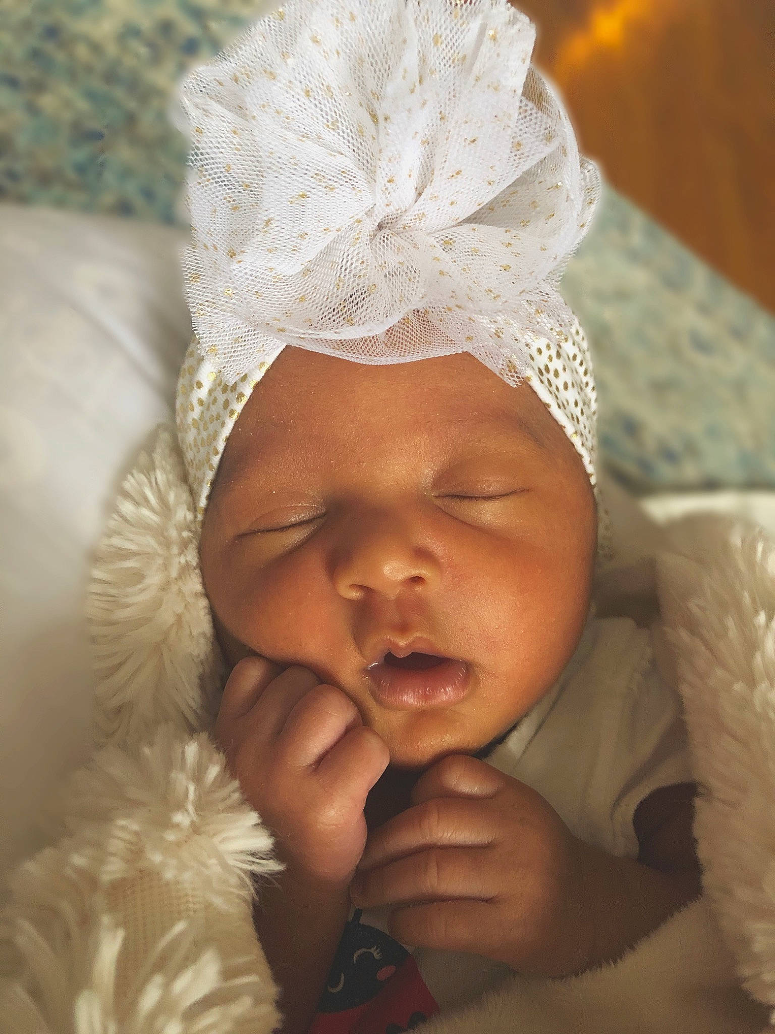 Lux is registered to the contest to win money with this photo: baby, bonnet, cheek, child, ear, eye, face, fashion_accessory, hand, happy, head, headgear, headwear, lip, nose, person, photography, skin, sleep, smile