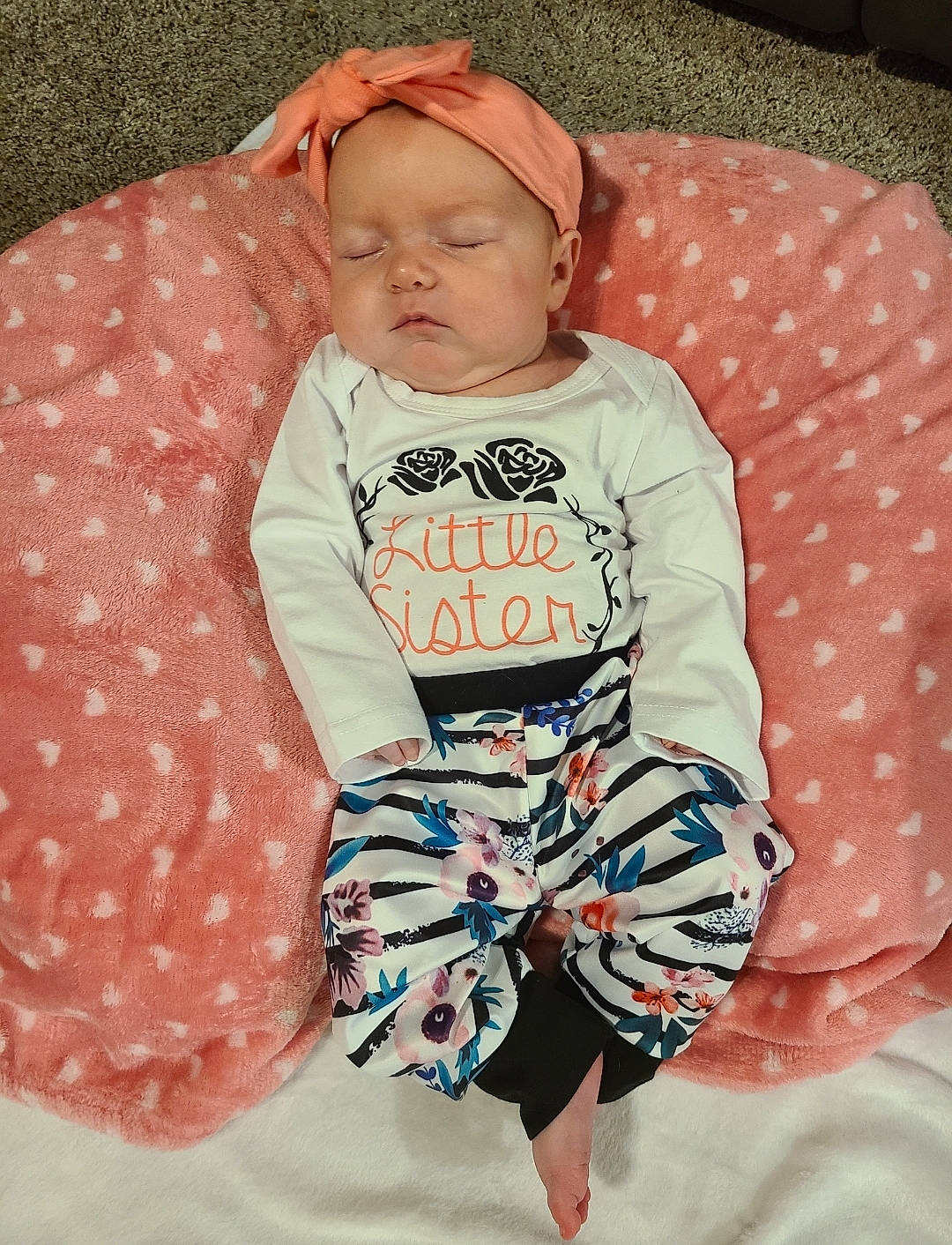 Opal is registered to the contest to win money with this photo: baby, baby_products, baby_sleeping, baby_toddler_clothing, cheek, child, circle, collar, comfort, happy, linens, pattern, person, pink, play, portrait_photography, sitting, sleeve, textile, toddler
