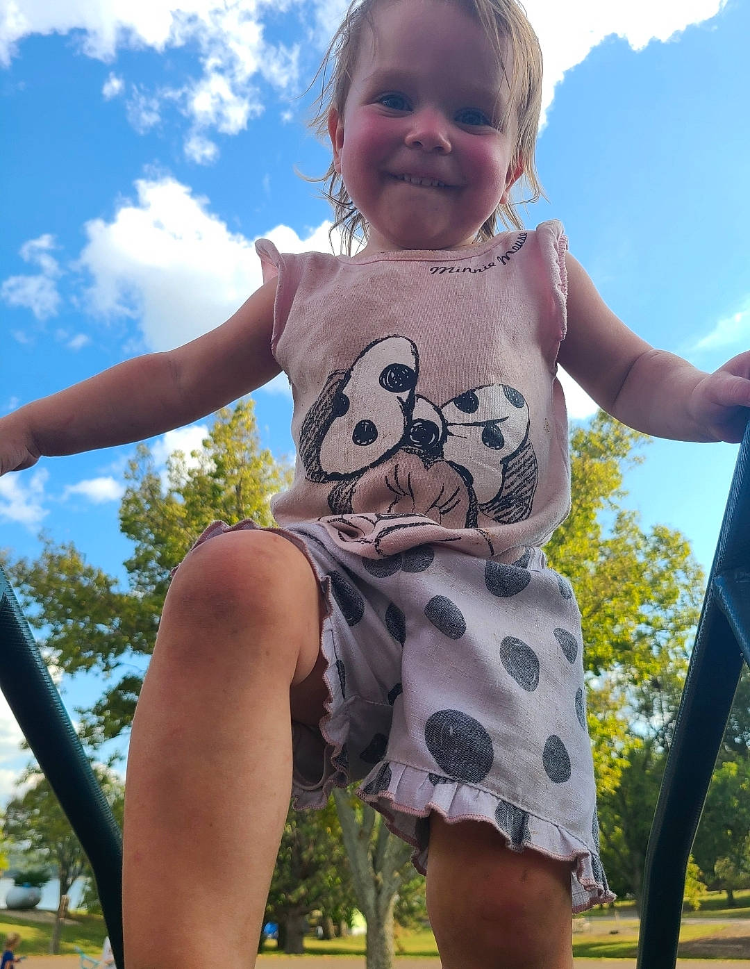 Iris is registered to the contest to win money with this photo: baby_toddler_clothing, cloud, facial_expression, fun, grass, happy, joy, leisure, people_in_nature, person, photograph, pink, shoulder, skin, sky, sleeve, smile, standing, summer, toddler