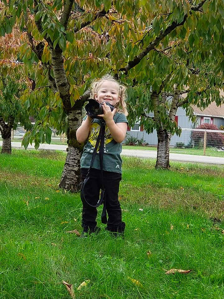 Addalyn is registered to the contest to win money with this photo: botany, branch, child, grass, joy, lawn, leaf, person, photography, plant, recreation, tourism, tree, vacation, woody_plant