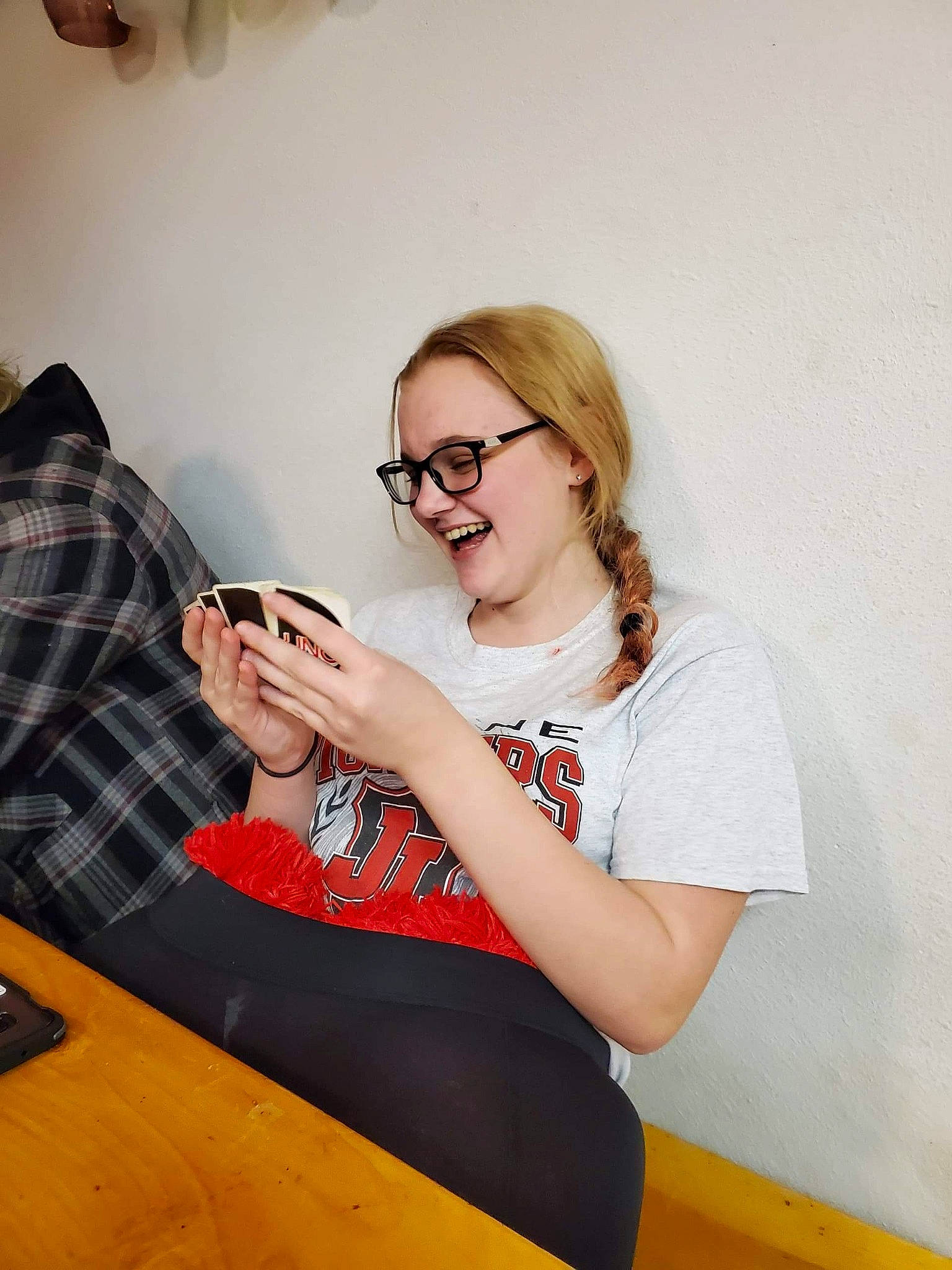 Alexia is registered to the contest to win money with this photo: design, eyewear, glasses, joy, pattern, person, room, sitting, t_shirt, technology, textile, vision_care