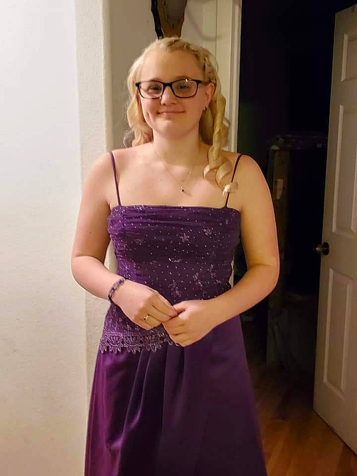 Alexia is registered to the contest to win money with this photo: arm, blond, bridal_party_dress, ceremony, clothing, cocktail_dress, dress, eyewear, finger, formal_wear, glasses, gown, hand, joy, long_hair, person, prom, purple, satin, shoulder