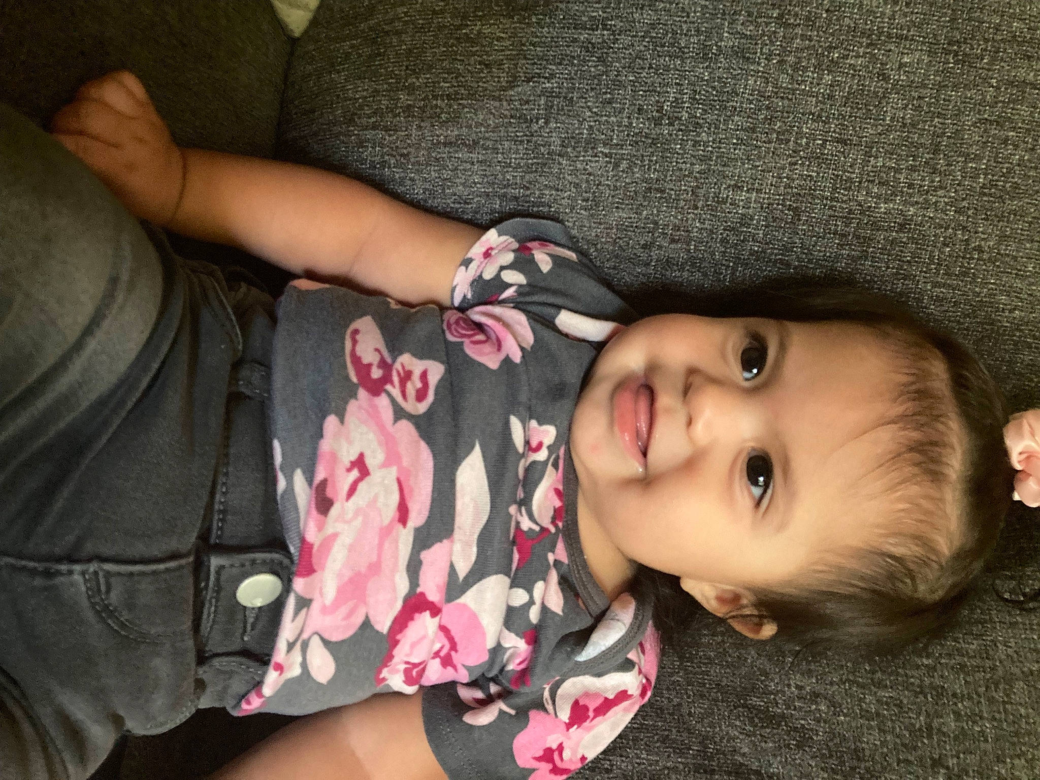 Annalise is registered to the contest to win money with this photo: baby, baby_toddler_clothing, black_hair, cheek, child, cool, eyelash, finger, human_leg, joint, joy, lip, mouth, nose, person, plant, skin, sleeve, smile, toddler